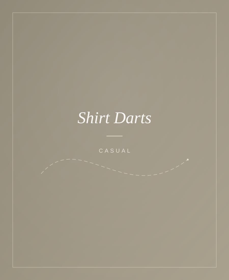 Dress shirt slimmed with back darts, pinned on a mannequin